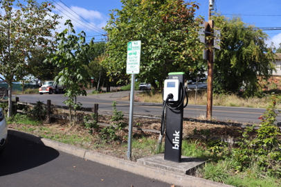North view parking lot – two electric vehicle [EV] charging stations on the Blink Network